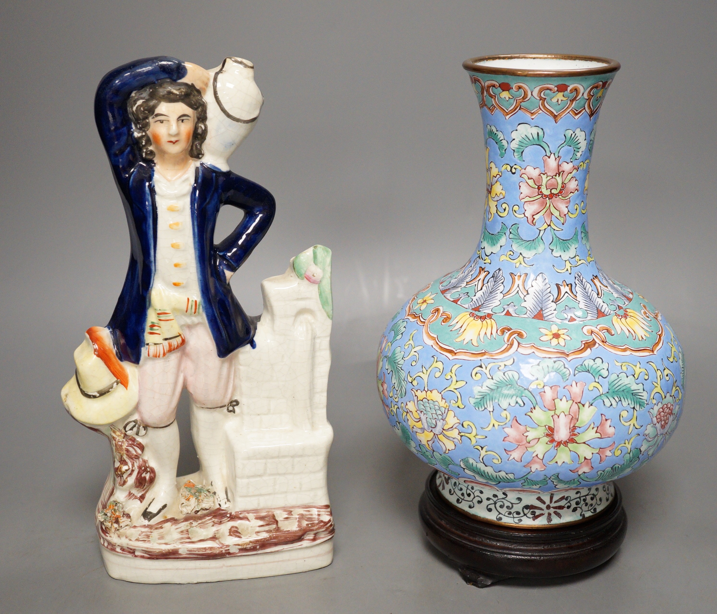 A Chinese canton enamel vase, wood stand, 23.5cm tall